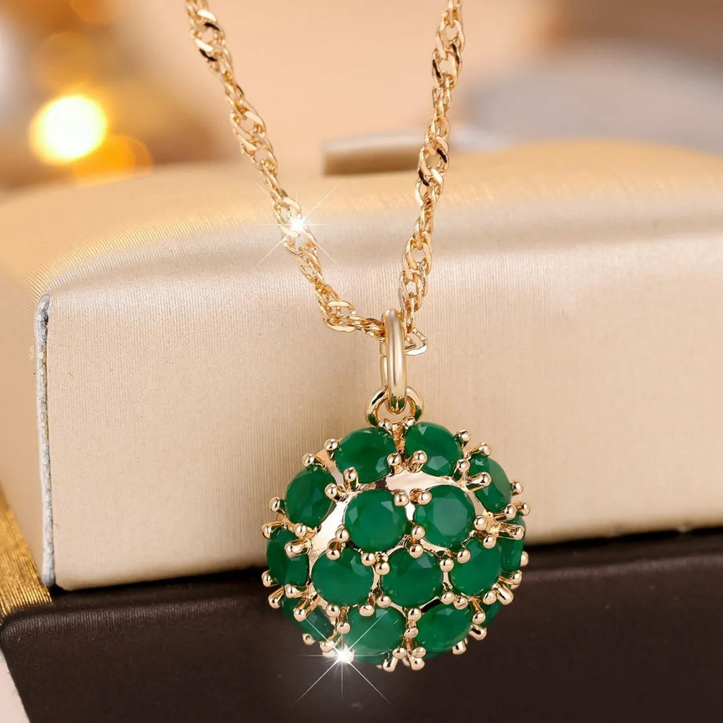 Geometric pendant necklace with round emerald diamond centrepiece on adjustable chain
