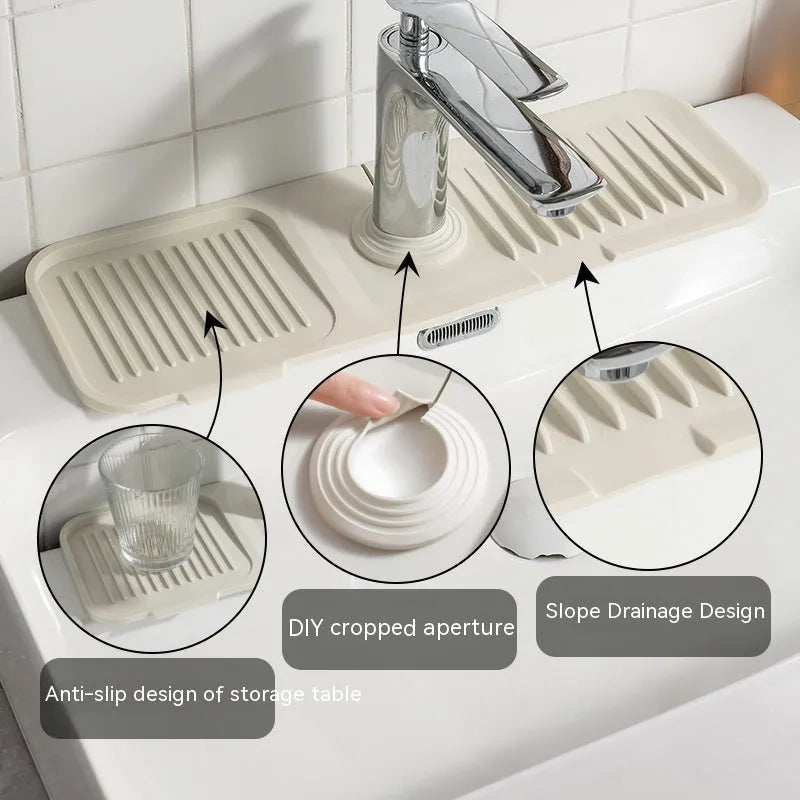 Silicone sink splash guard mat under a kitchen faucet in light grey colour