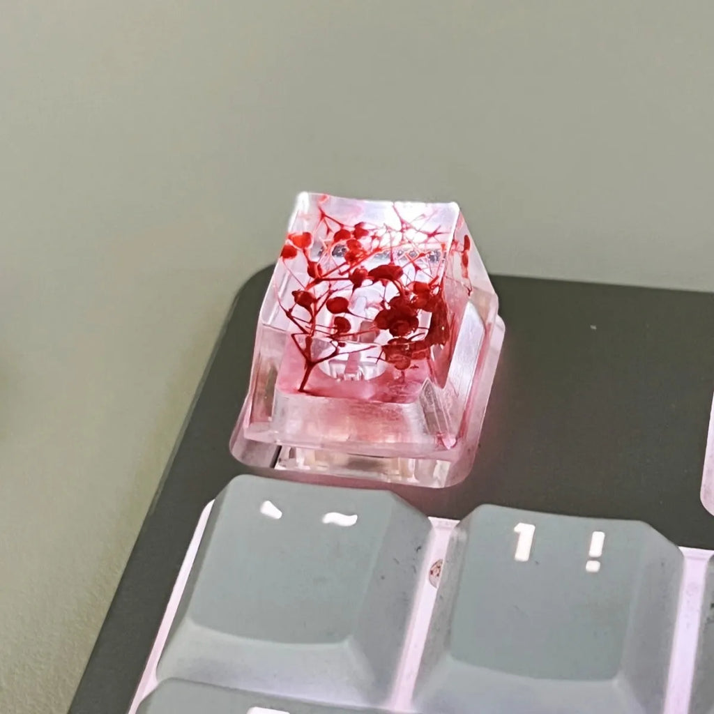 Clear resin mechanical keyboard keycap with starry sky design in green.