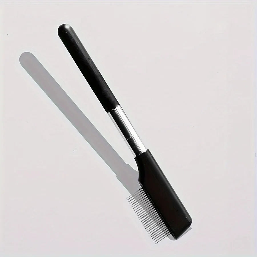Black pet grooming brush with soft bristles for gentle eye area cleaning on dogs and cats