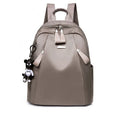Medium grey Oxford cloth rucksack with double shoulder straps and front digging pocket.
