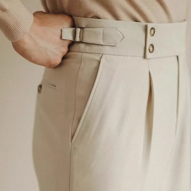 Men's slim fit straight-leg suit trousers in black, white, and apricot colours on a hanger.