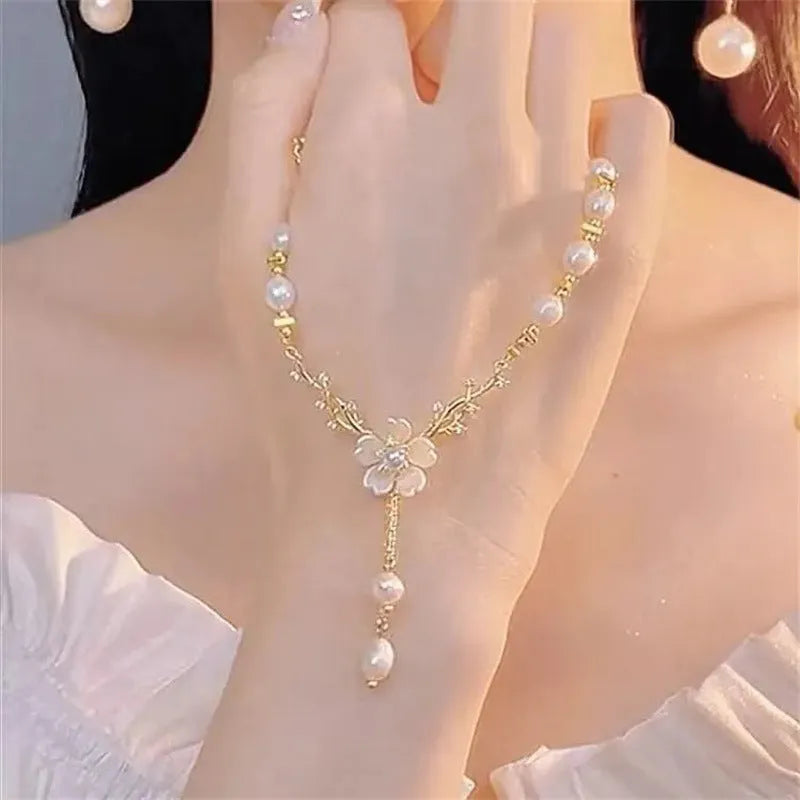 Alloy fashion necklace with pearl flower pendant featuring rose detailing in pearl flower colour