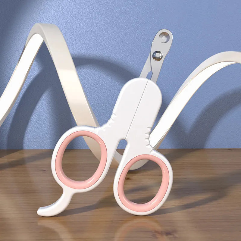 Professional grey pet nail clippers with curved tip and rubber-coated handle for trimming cat and small dog claws.
