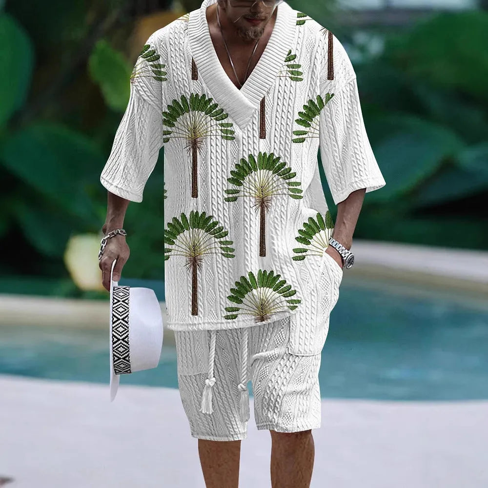 Man wearing a loose casual short sleeve suit top and matching shorts in a solid colour