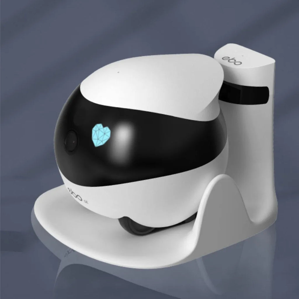 White smart home mobile surveillance robot camera on table with automatic docking station