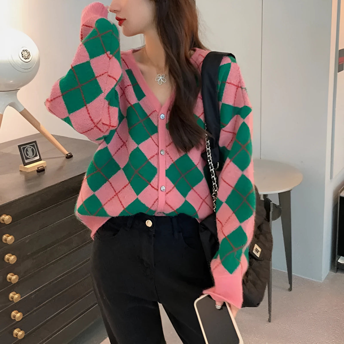 A knitted casual cardigan in a macaron colour, shown in a regular fit with regular-length sleeves.