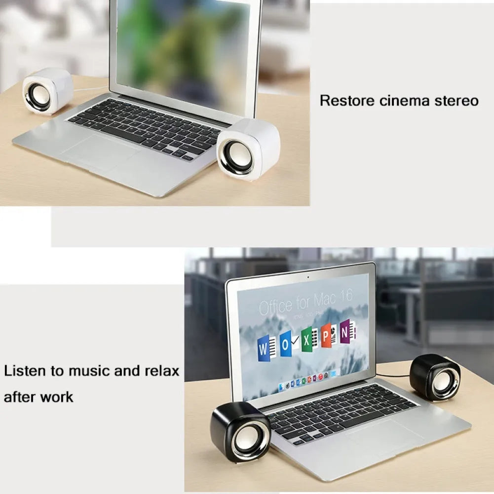 Compact black wired desktop computer speaker pair with 3.5mm plug next to a laptop.