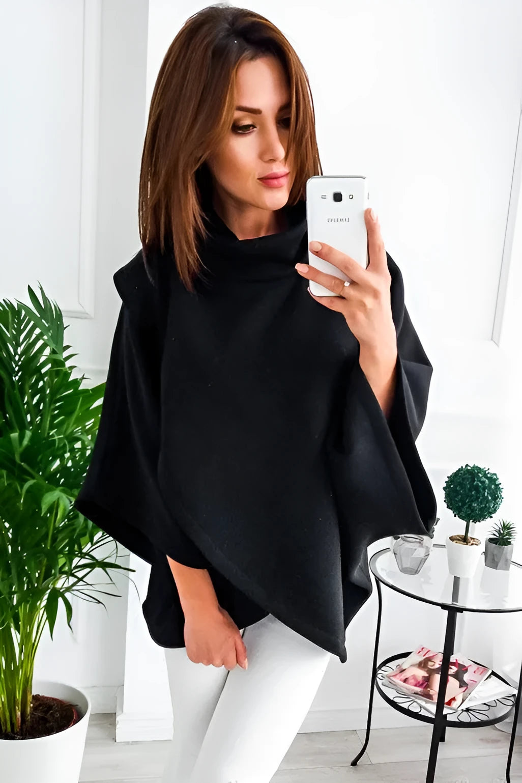 Women's long grey batwing sleeve cardigan sweatshirt with three-button front and stitching detail.