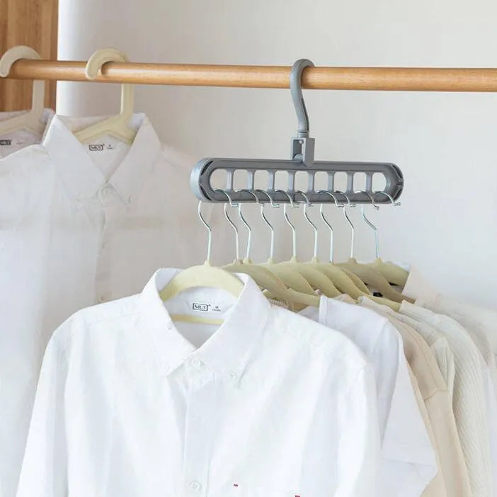 Plastic clothes hanger with rotating hook in pink or green colour for heavy garment storage