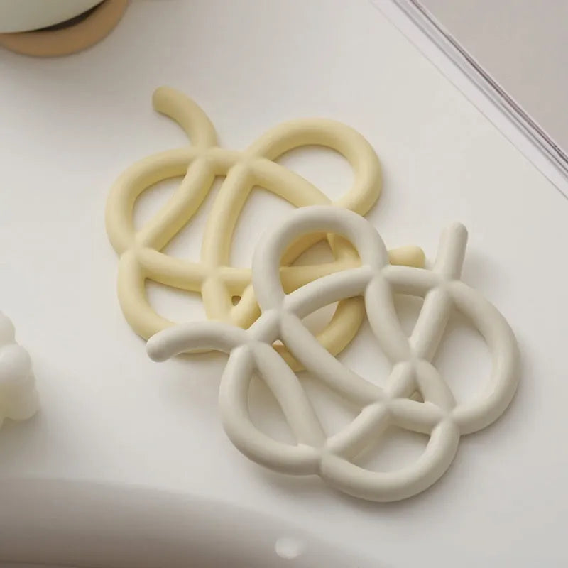 Ceramic heat proof placemat in irregular shape on a dining table