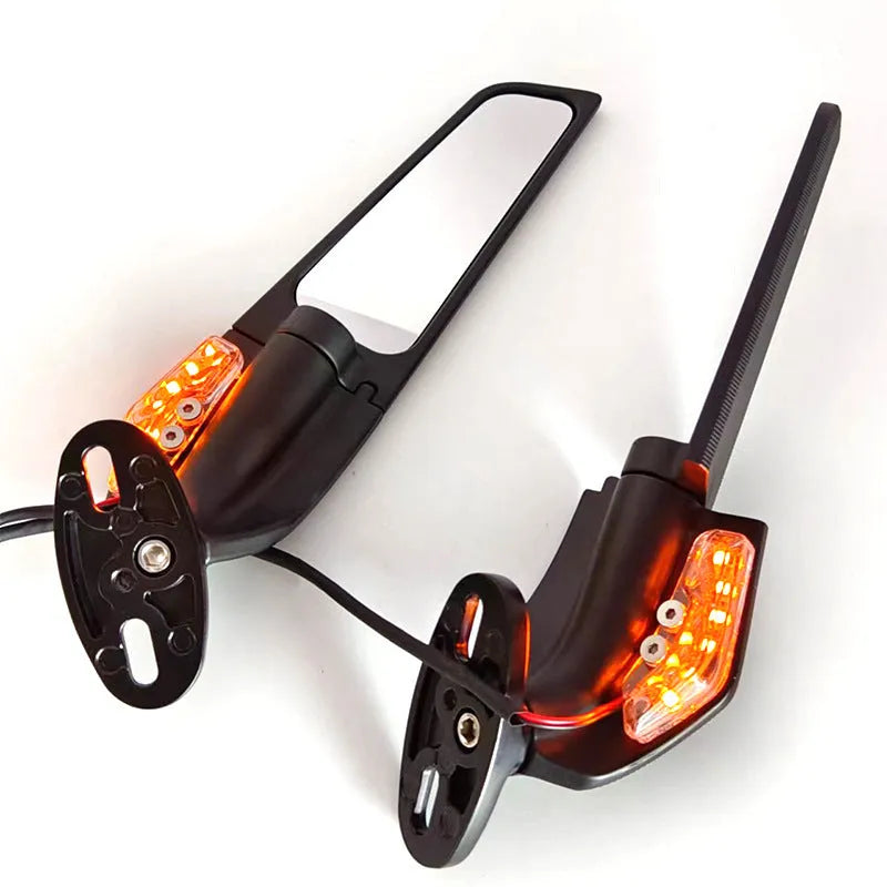 Pair of yellow motorcycle rearview mirrors with convex glass lenses and integrated LED running lights.