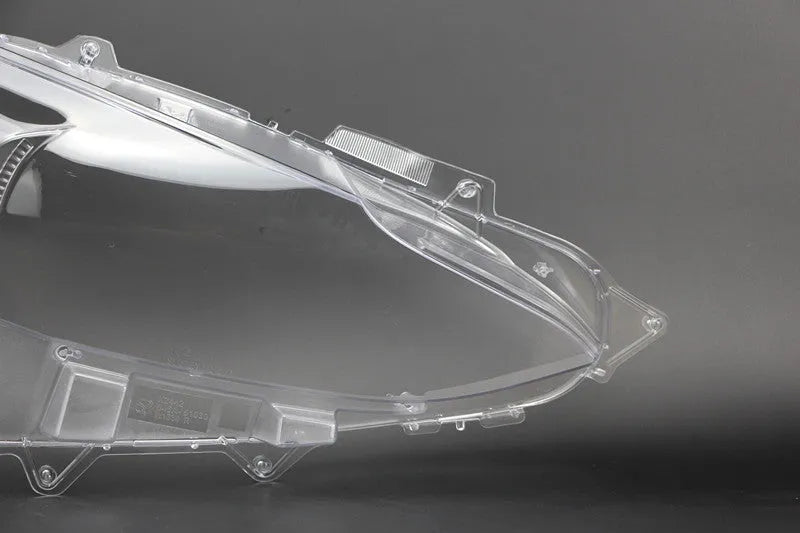 Mazda 3 Exela model headlamp replacement cover with snake glue adhesive.