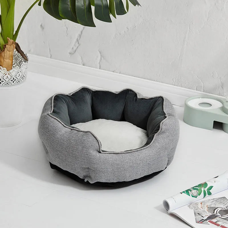 Blue octagonal pet bed with high sides, soft interior, and a removable mat for a cat or small dog.