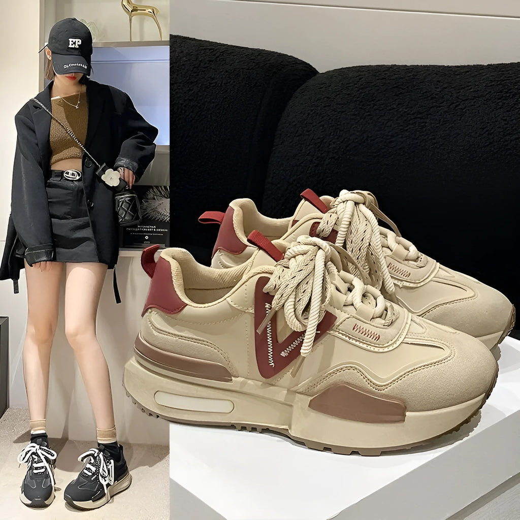 Women's black retro platform sports shoes with round toe and lace-up fastening on a rubber sole.