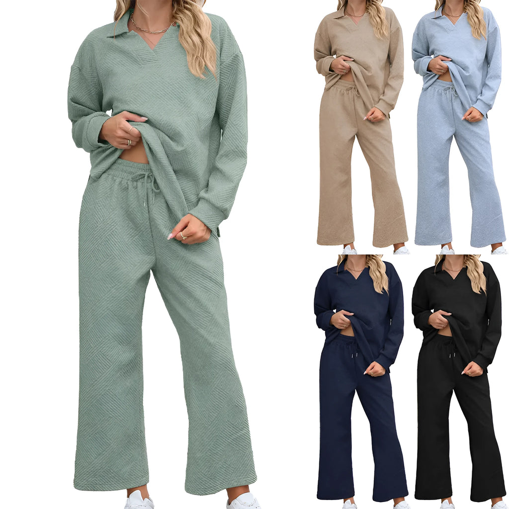 Women's black knitted jacquard sweater and elastic waist cropped trousers suit set on a hanger