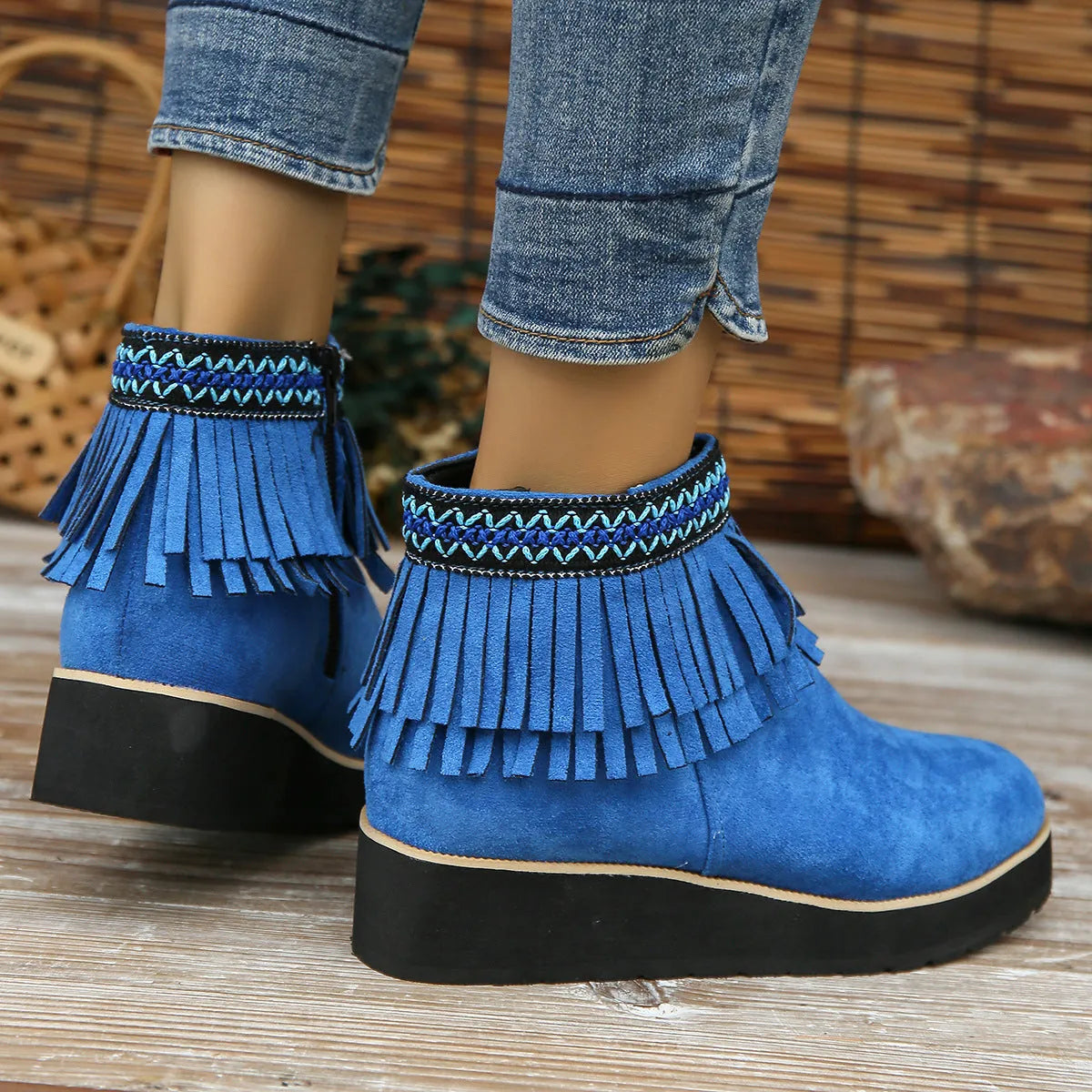 Women's dark brown suede wedge ankle boots with side zip, waterproof platform, and tassel detail.