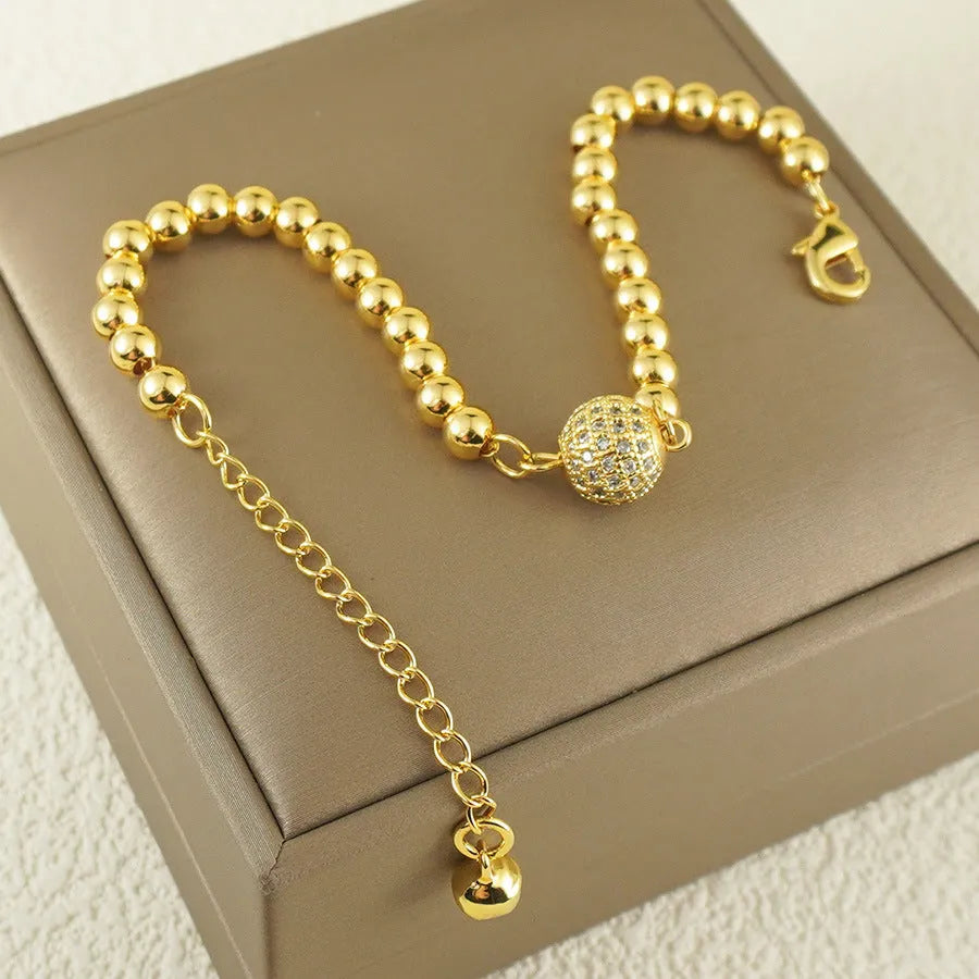 Women's copper bracelet with heart-shaped Arabic design and zircon stone detailing