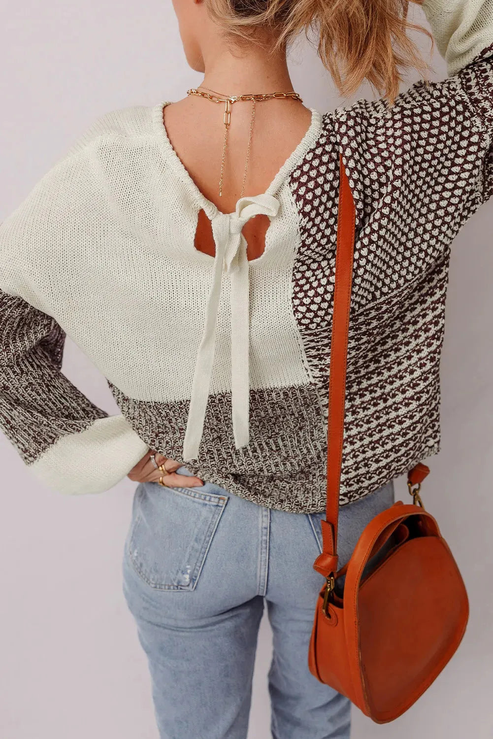 Dark khaki loose sweater with colour block pattern and back tie detail, drop shoulder design