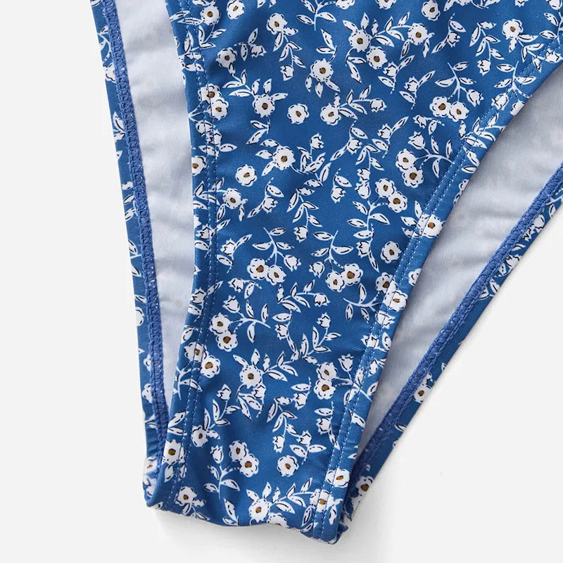 Blue polyester three-piece swimsuit set with top and shorts for women