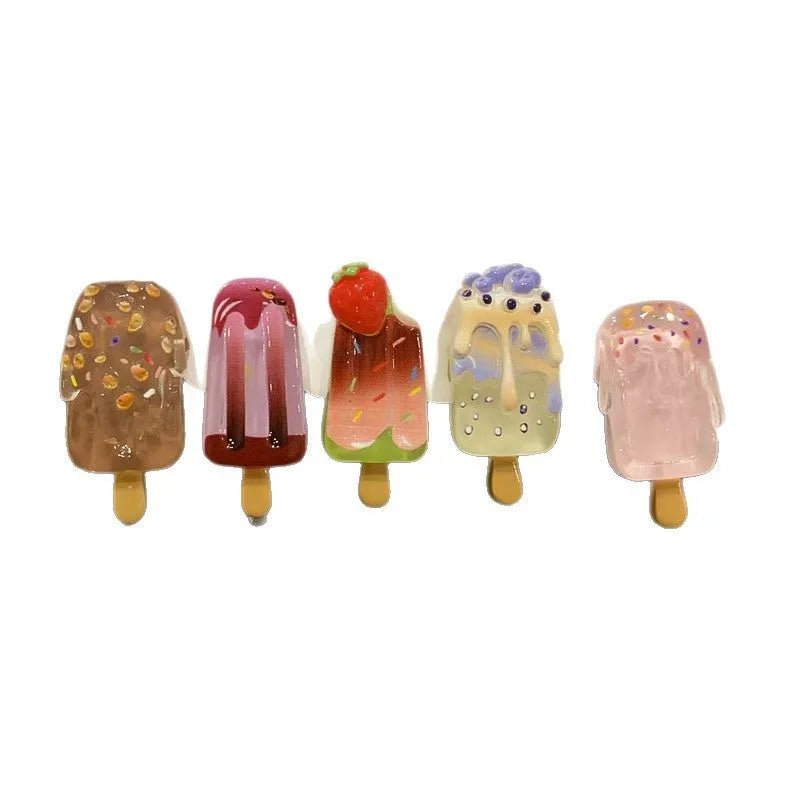 Cartoon ice cream themed resin barrette hair clip in side clip style on a colour background.