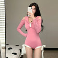 Women's long sleeve one-piece swimsuit in polyester fabric available in pink and black colours