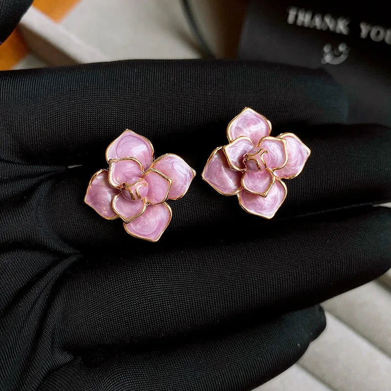 Gold plated purple oil-spot glaze flower stud earrings on copper base with floral design