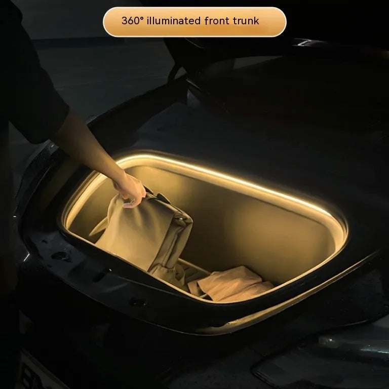 Tesla Model 3 front console illuminated by a soft silicone LED ambient light bar.
