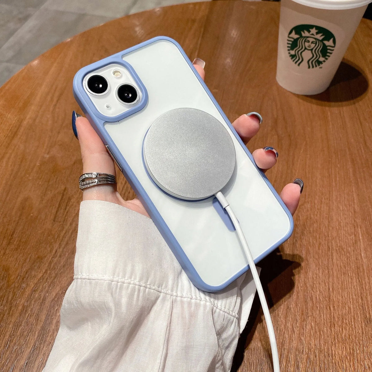 Transparent acrylic MagSafe phone case showing magnetic ring and clear back design