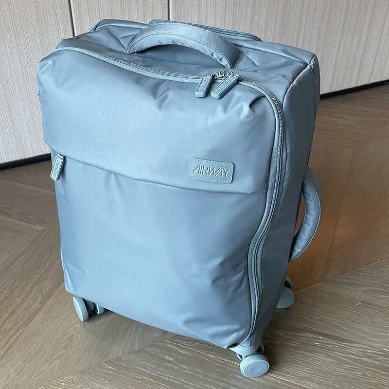 Ultra-light waterproof Oxford cloth suitcase in bluestone green with universal wheels