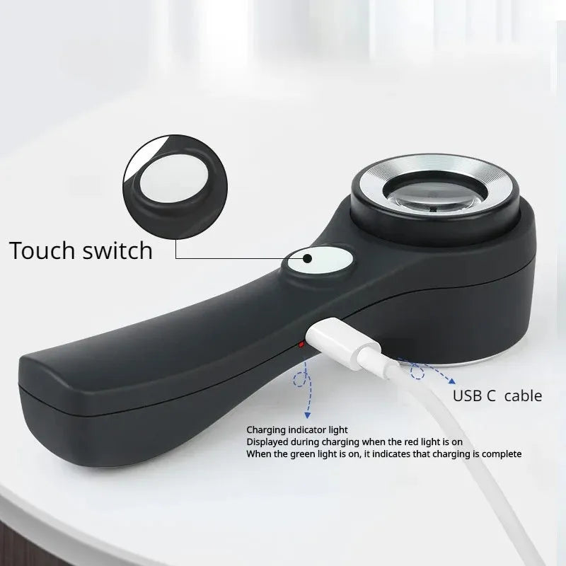 Black aluminium magnifying glass with optical lens and USB-C cable for jewellery appraisal