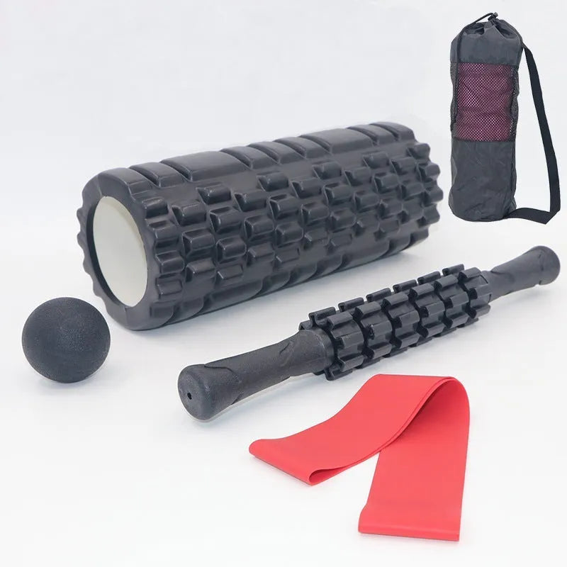 Black foam massage roller stick with six gear segments, 33cm long.