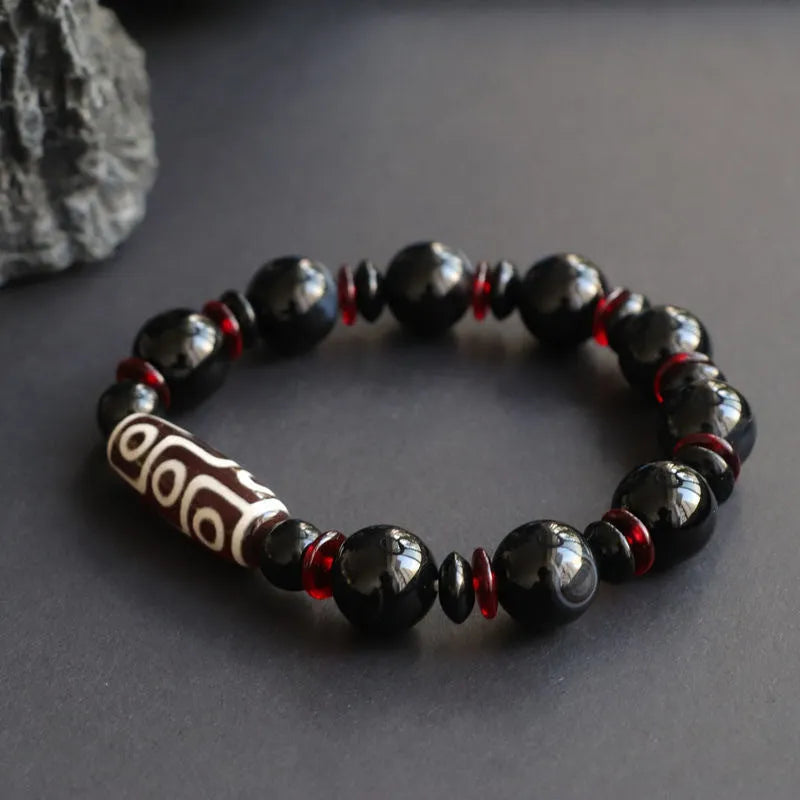 Black agate dzi bead bracelet with 11mm geometric beads in hand-woven unisex design