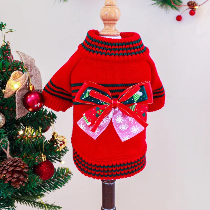 A red polyester Christmas jumper for a dog, showing the festive design and knit fabric.