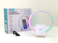 White smart Bluetooth speaker and wireless charging pad with ambient light, showing slim 10mm profile