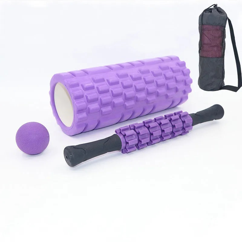 Black foam massage roller stick with six gear segments, 33cm long.