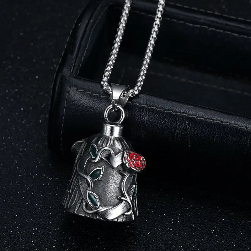 Polished titanium steel motorcycle lucky bell pendant with a double-sided epoxy rose in a geometric shape.