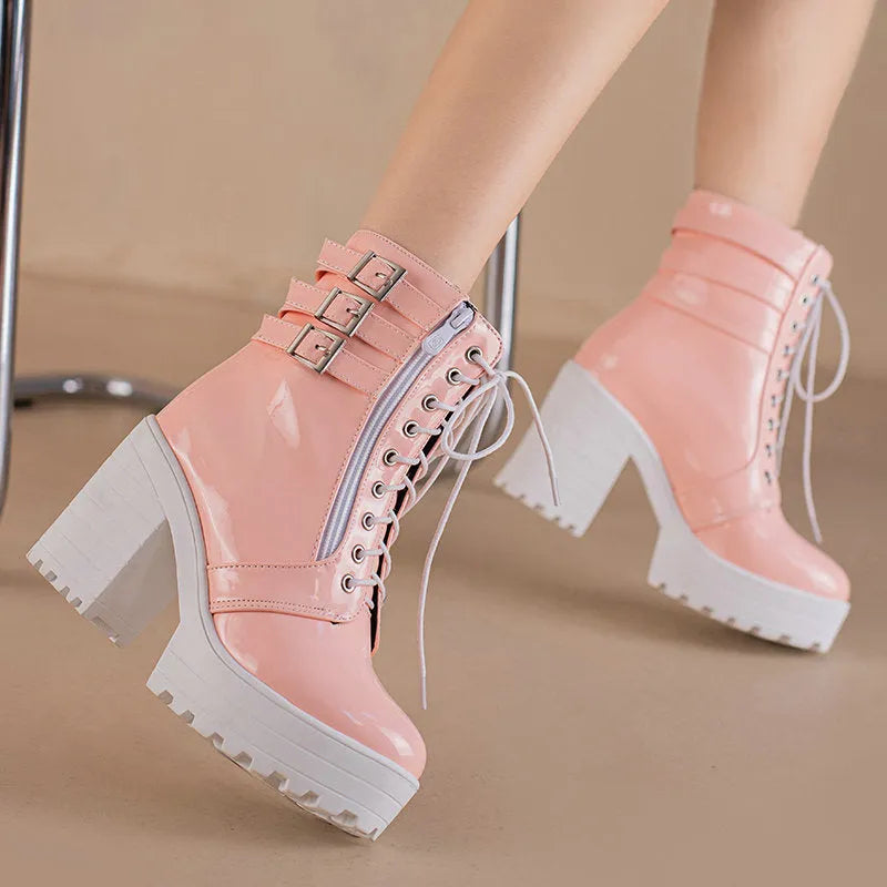 Women's black thick-heeled short boots with lace-up front and waterproof platform on a rubber sole.