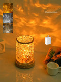 Rotating water ripple night light with acrylic housing on solid wood base showing touch control