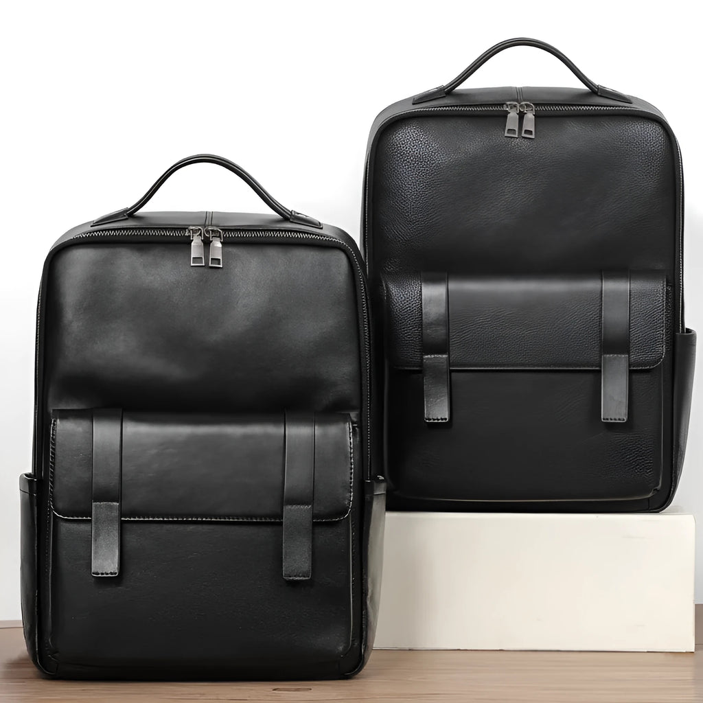 Black leather computer backpack with woven detailing and 36-55L capacity for business commute