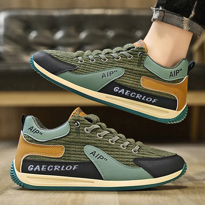 Men's grey and green mesh running shoes with viscose soles and lace-up fastening