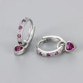 Women's fashion earrings with heart-shaped drops featuring coloured zircon stones in gold or white gold colour plating