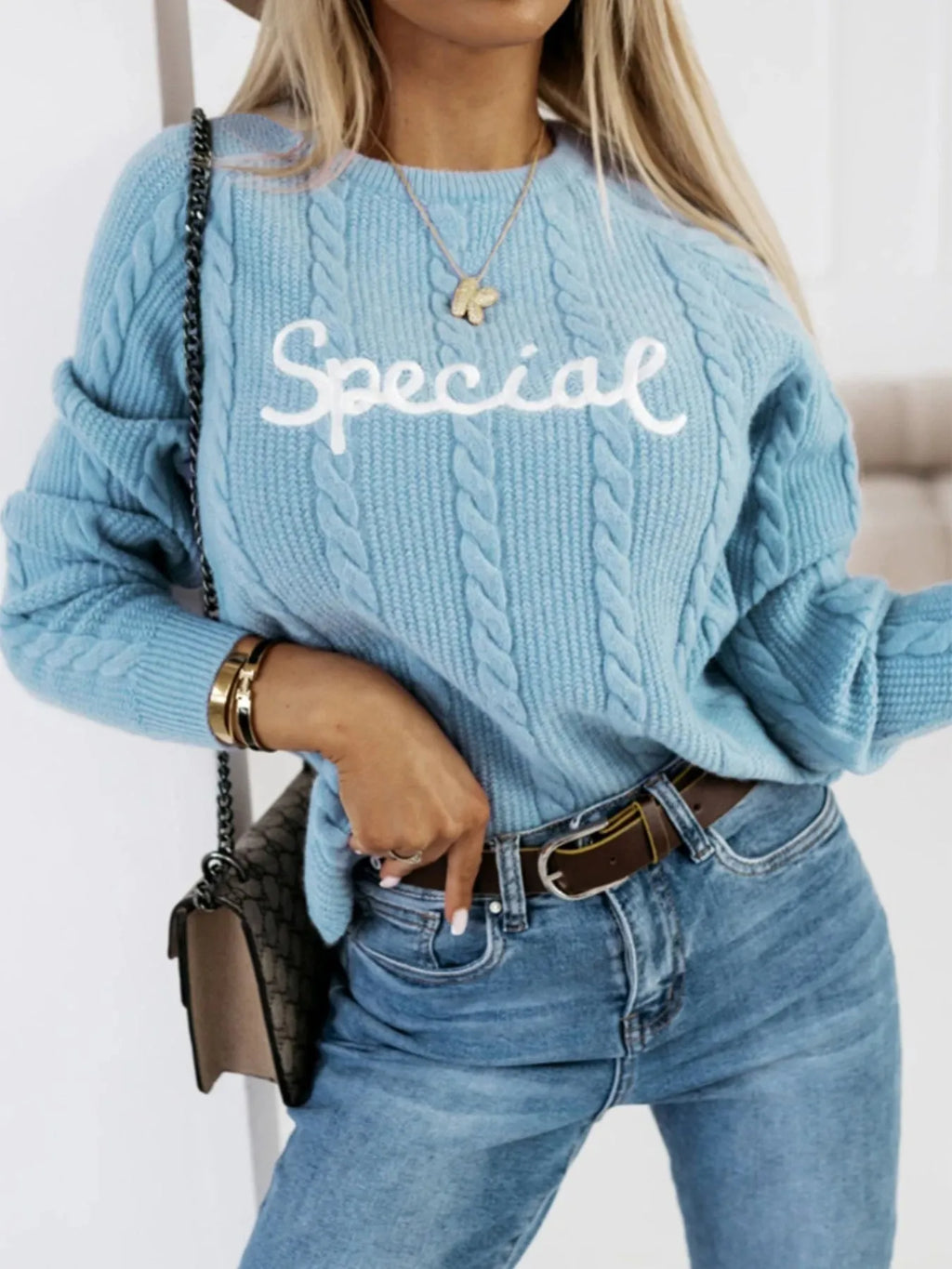 Blue men's crew neck pullover sweater with embroidered letters and numbers design