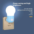 Plug-in bedside baby night lamp in white, blue, or pink shell with round modern design.