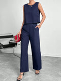 Red polyester two-piece set with sleeveless round neck top and wide leg trousers