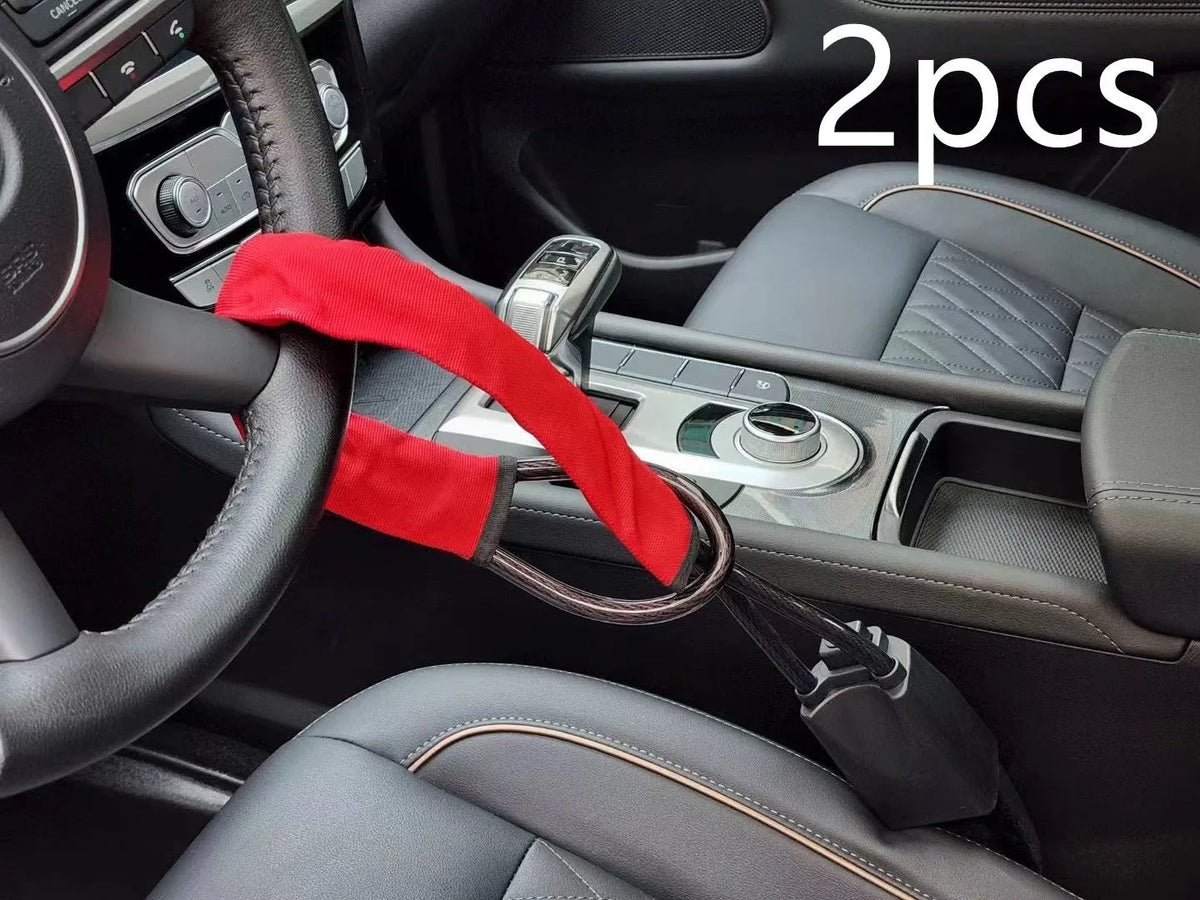 Red iron car steering wheel lock with wire rope for General Motors vehicles.