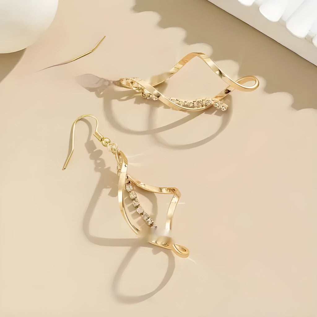 Gold spiral geometric earrings for women with ellipse detailing on alloy metal