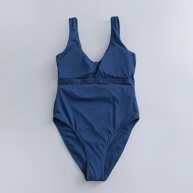 Navy blue one-piece women's swimsuit with triangle slimming shape and chest pads
