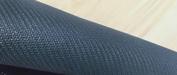 Large printed desk pad mouse mat with natural rubber non-slip base on a wooden desk.