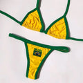 Women's yellow polyester T-back bikini set with matching shorts on a mannequin.